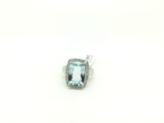 Aquamarine and diamond dress ring, central rectangular cut aquamarine approximately 13.5 x 9mm,