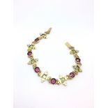 Victorian garnet, peridot and pearl bracelet, six vibrant round cut almandine garnets, set between