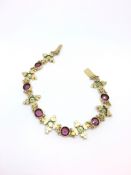 Victorian garnet, peridot and pearl bracelet, six vibrant round cut almandine garnets, set between