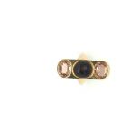 An unusual imperial topaz and garnet intaglio panel ring, central carved garnet intaglio set with