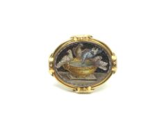 19th Century micro mosaic brooch depicting 'Capitoline Doves' set within a yellow gold border with