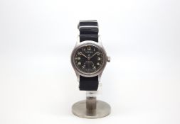 Vintage military Vertex wristwatch, black circular dial with luminous Arabic numerals, crows foot