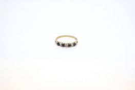 Sapphire half eternity ring, four round cut sapphires in a twist style half eternity ring style