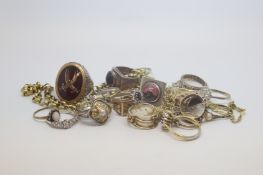 A large selection of silver alberts chains including shields and coins, marked and tested silver,