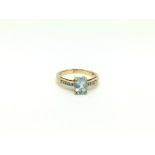 Aquamarine and diamond ring, oval cut aquamarine measuring approximately 7.9 x 5.8mm, with diamond