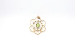 Art Nouveau peridot and pearl pendant, 6mm round cut peridot with a border of six seed pearls,