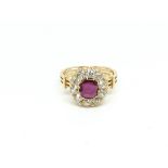 Ruby and diamond cluster ring, central oval cut ruby weighing an estimated 0.90ct, surrounded by old