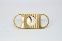 Davidoff yellow metal and diamond cigar cutter, gross weight approximately 40grams, marked Plaque or