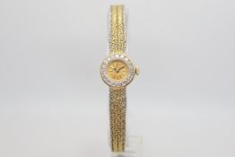 Ladies Rolex cocktail watch, circular dial, diamond set bezel, 17mm case, intergraded two tone