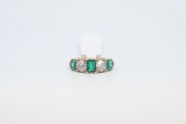 Antique Emerald and Diamond Half Hoop Ring. Two Old cut Diamonds in between three emeralds. Yellow