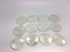 A quantity of 12 Silver Canadian 5 Dollar fine silver coins, 9999, weighing approximately 374g