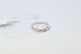 Cubic zircona half eternity ring, in 9ct white gold, ring size L