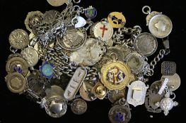 A large selection of silver alberts chains including shields and coins, marked and tested silver,