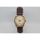 Gentlemen's Smiths Deluxe 9ct Gold watch, circa 1950s, silver two tone dial, gold dagger hands,