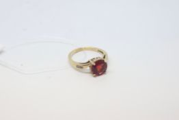 Red paste ring, circular red paste with three diamonds to each shoulder, in 9ct yellow gold, ring