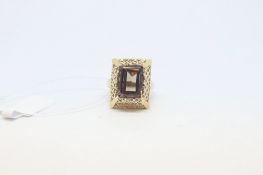 Smoky quartz ring, in an openwork rectangular surround and gallery, mounted in 9ct yellow gold, ring