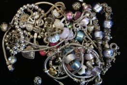 A quantity of mostly modern charm bracelets and charms including LoveLinks, weighing approximately