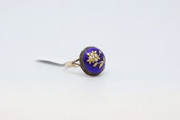 Enamel flower ring, circular blue enamel with a gold coloured flower to the centre, with a rope