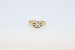 Single stone diamond ring. The diamond weighing approximately 0.90cts in a yellow mount stamped
