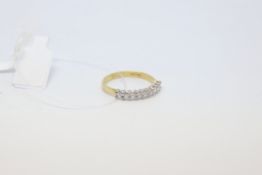 Diamond half eternity ring, nine round brilliant cut diamonds claw set in white metal on an 18ct