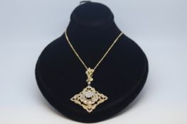 Diamond cluster pendant, square design set with a central cluster of round brilliant cut diamonds,