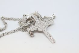 9ct white gold cross pendant set with cubic zirconias, gross weight approximately 45 grams