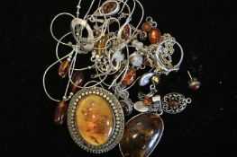 A quantity of mostly amber jewellery including pendants and earrings, weighing approximately 70g