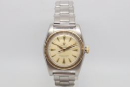 Vintage Rolex Oyster Perpetual 'Bubble Back', circular dial with dagger hour markers, gold outer