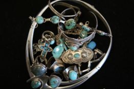 A quantity of mostly turquoise set jewellery including rings, pendants and bangle, weighing