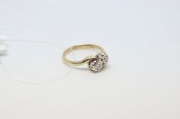 Two stone diamond ring, round brilliant cut diamonds weighing an estimated total of 0.10ct, set in