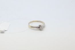Diamond ring, central brilliant cut diamond with diamond set shoulders, estimated total diamond