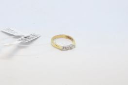 Three stone diamond ring, brilliant cut diamonds, set in 18ct yellow gold, ring size J