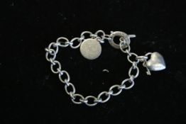 Links of london charm bracelet with 2x charms