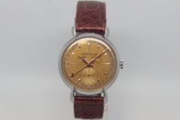 Vintage Jaeger-LeCoultre triple calendar, circular dial with day and month apertures, dagger hour