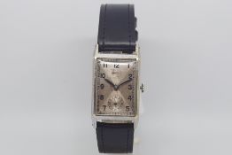 Vintage Rolco wrist watch, rectangular two tone dial, black Arabic numerals, subsidiary seconds