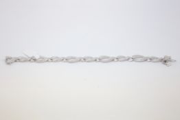 Diamond bracelet, crossover oval links, pave set with round cut diamonds, each separated by circular