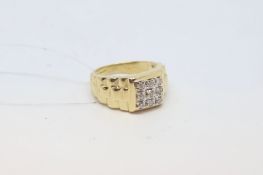 Gentlemen's diamond cluster ring, nine round brilliant cut diamonds set in a square with textured