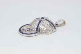 Sapphire and diamond 'Jockey Cap' pendant, in 18ct white gold, pave set diamond cap , set with