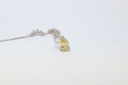 Gem set pendant, yellow and white pear cut cubic zirconias, set in white metal stamped 9ct on a