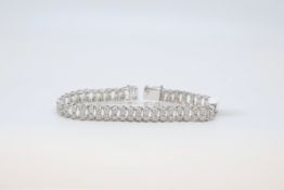 Diamond bracelet, each link set with two round cut diamonds set horizontally, estimated total