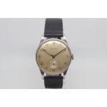 Vintage oversized Longines, circular silvered dial with Arabic numerals, subsidiary seconds dial,