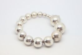 Georg Jenson silver bracelet, sixteen graduating silver beads, on a silver wire style bracelet,