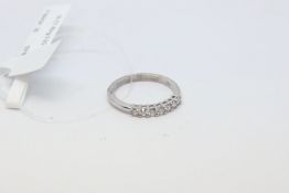 Diamond half eternity ring, seven round brilliant cut diamonds, estimated total diamond weight 0.