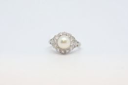 Pearl and diamond cluster ring, 7.25mm pearl set within a cluster of brilliant cut diamonds,