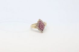 Ruby and diamond cluster ring, in a diamond shaped design, mounted in 9ct yellow gold, ring size
