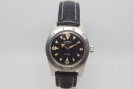 Vintage Le Cheminant automatic, circular black dial, luminous dagger hour markers, outer rotating