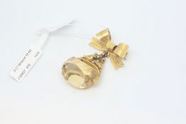 9ct yellow gold fob brooch, citrine spinner, on a 9ctyellow gold bow brooch