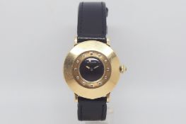 Vintage LeCoultre, circular black dial, heavy gold case with raised hour markers, inner case back