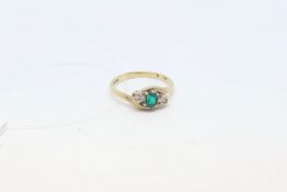 Three stone green paste and diamond ring, set in 9ct yellow gold, ring size L