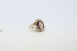 Smoky quartz ring, in an openwork gallery, mounted in 9ct yellow gold, ring size K1/2